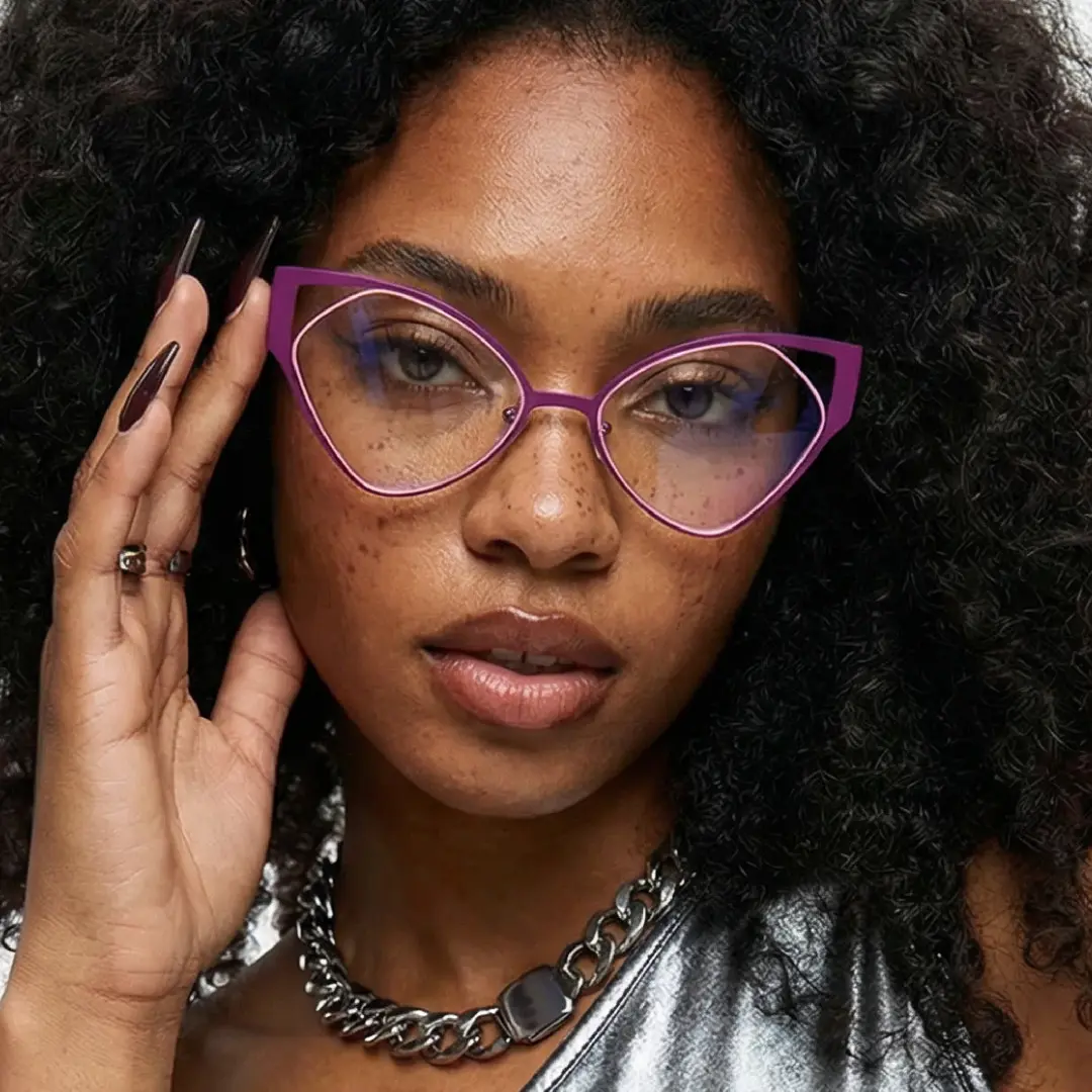 Front view of female wearing purple cat eye eyeglasses, touching frame, calm expression, CM0042311