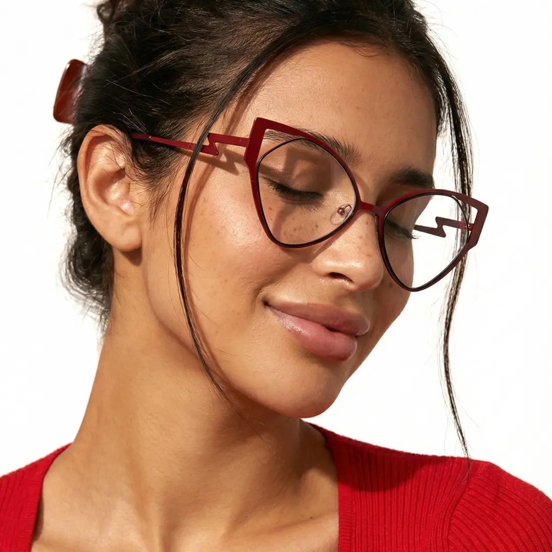 Three-quarter view of female wearing red cat eye eyeglasses, natural smile, CM0042311