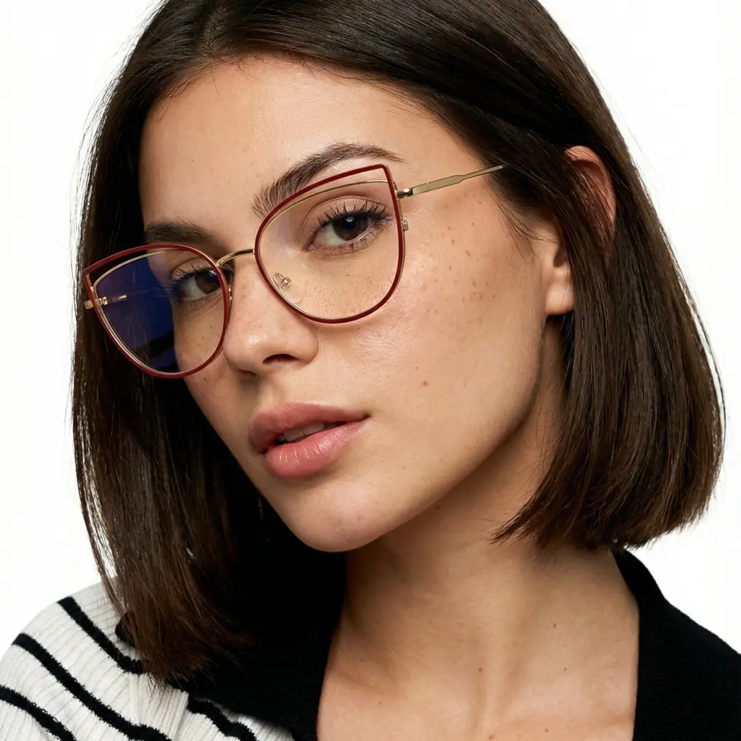 Three-quarter view of female wearing red cat eye eyeglasses, calm expression, CM0042408