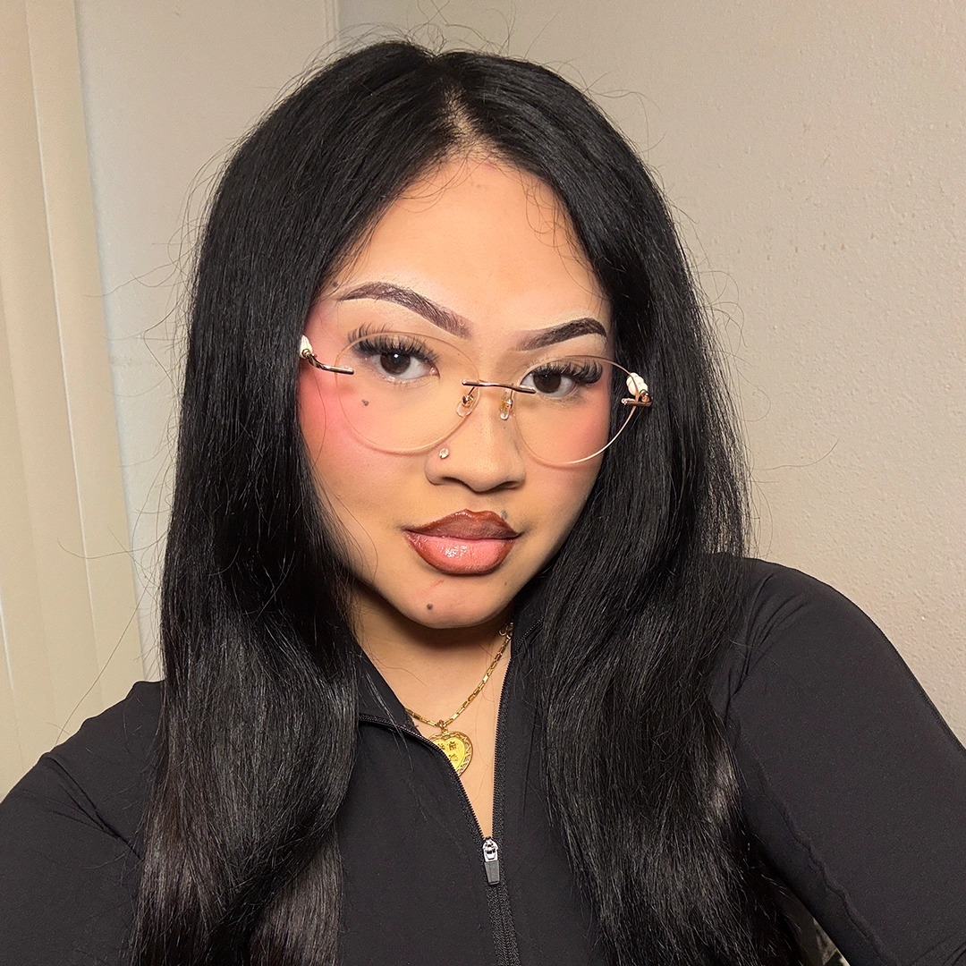 Front view of female wearing pink cat eye eyeglasses, neutral expression, CM0172511