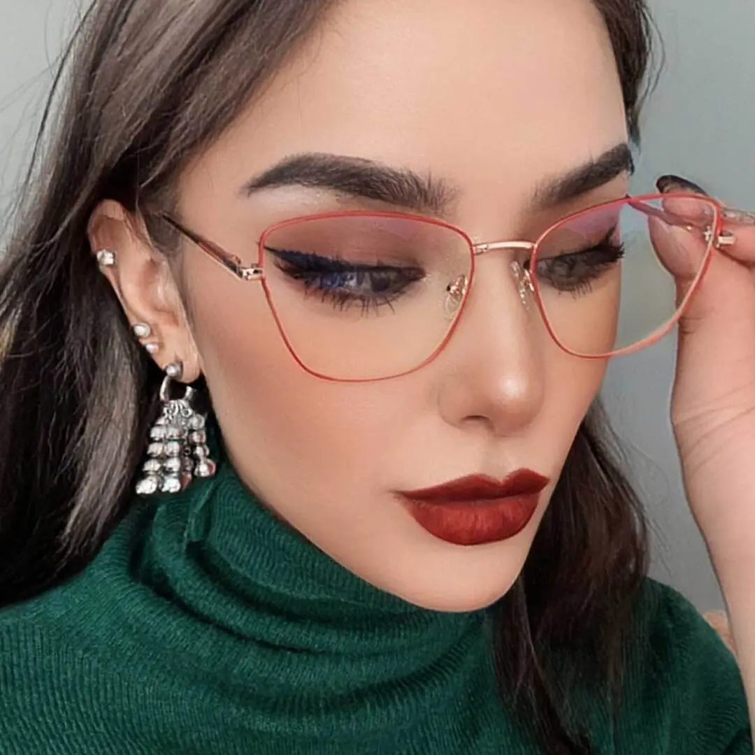 Slightly angled view of female wearing red cat eye eyeglasses, neutral expression, CM0202408