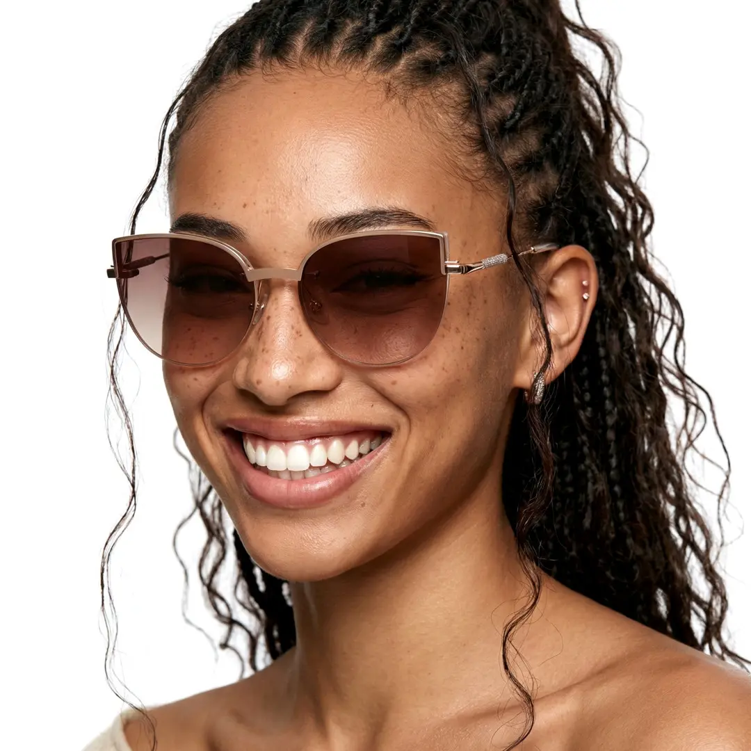 Front view of female wearing gold cat eye magnetic clip-on eyeglasses set with interchangeable toppers, big smile, CM0272601