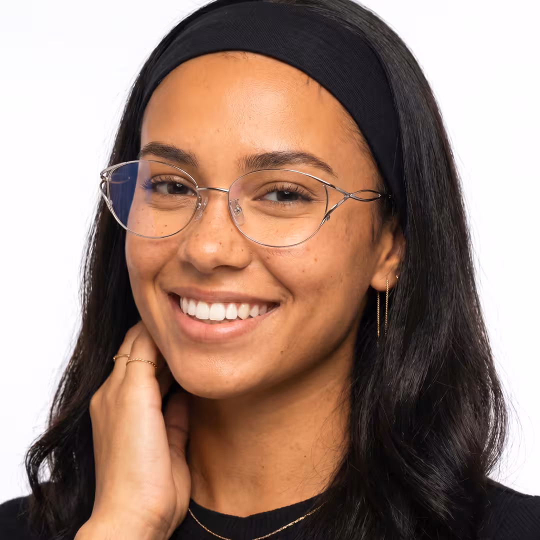 Female wearing fashion silver cat eye metal eyeglasses, natural smile. SPU: CM0282605