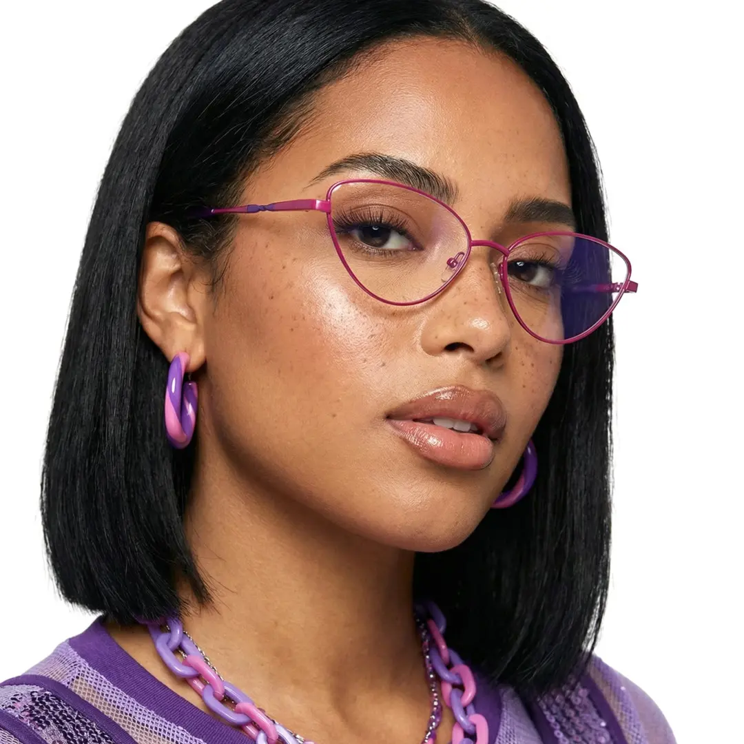 Three-quarter view of female wearing red cat eye eyeglasses, neutral expression, CM0472302