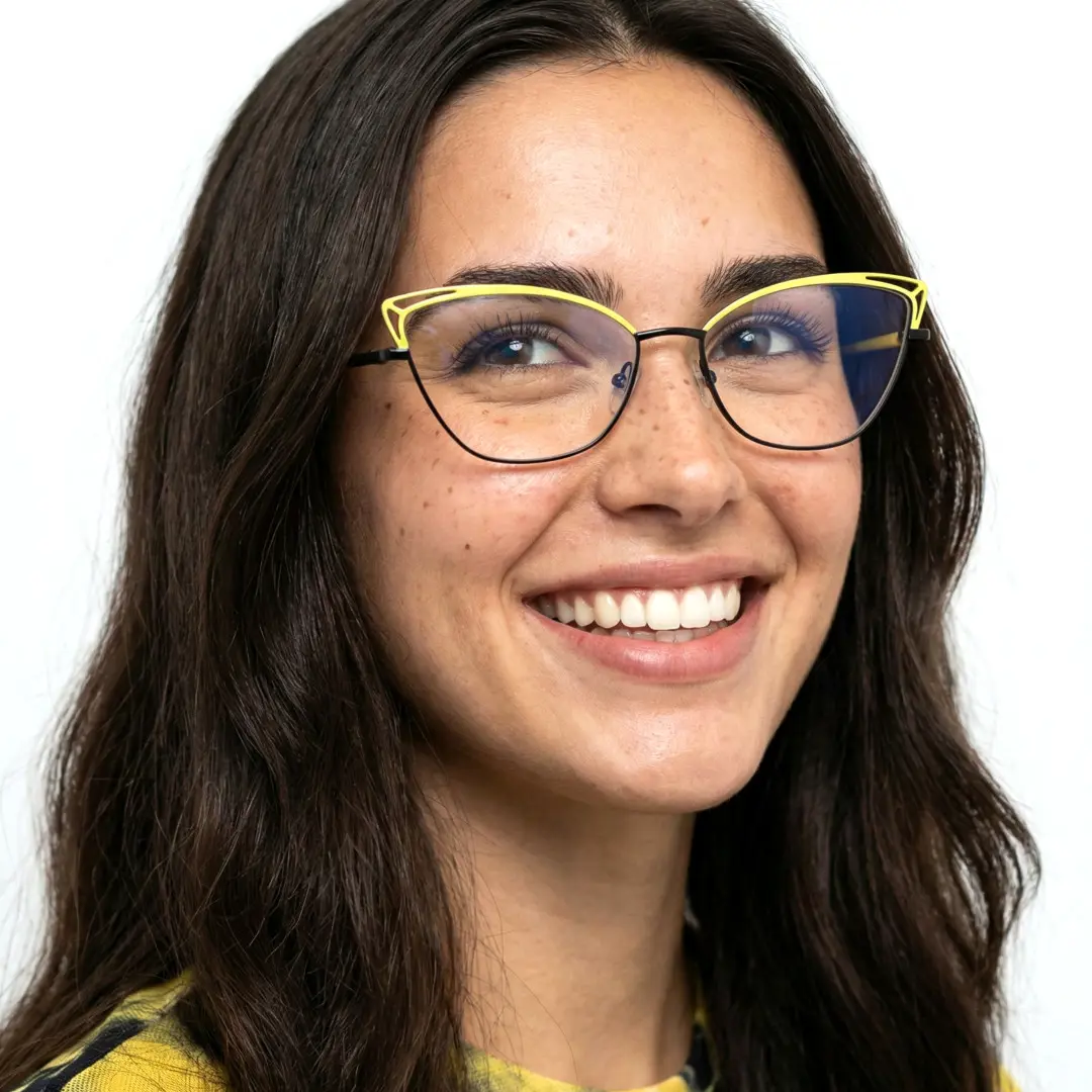 Looking away view of female wearing colorful yellow cat eye eyeglasses, smiling, CM0482302