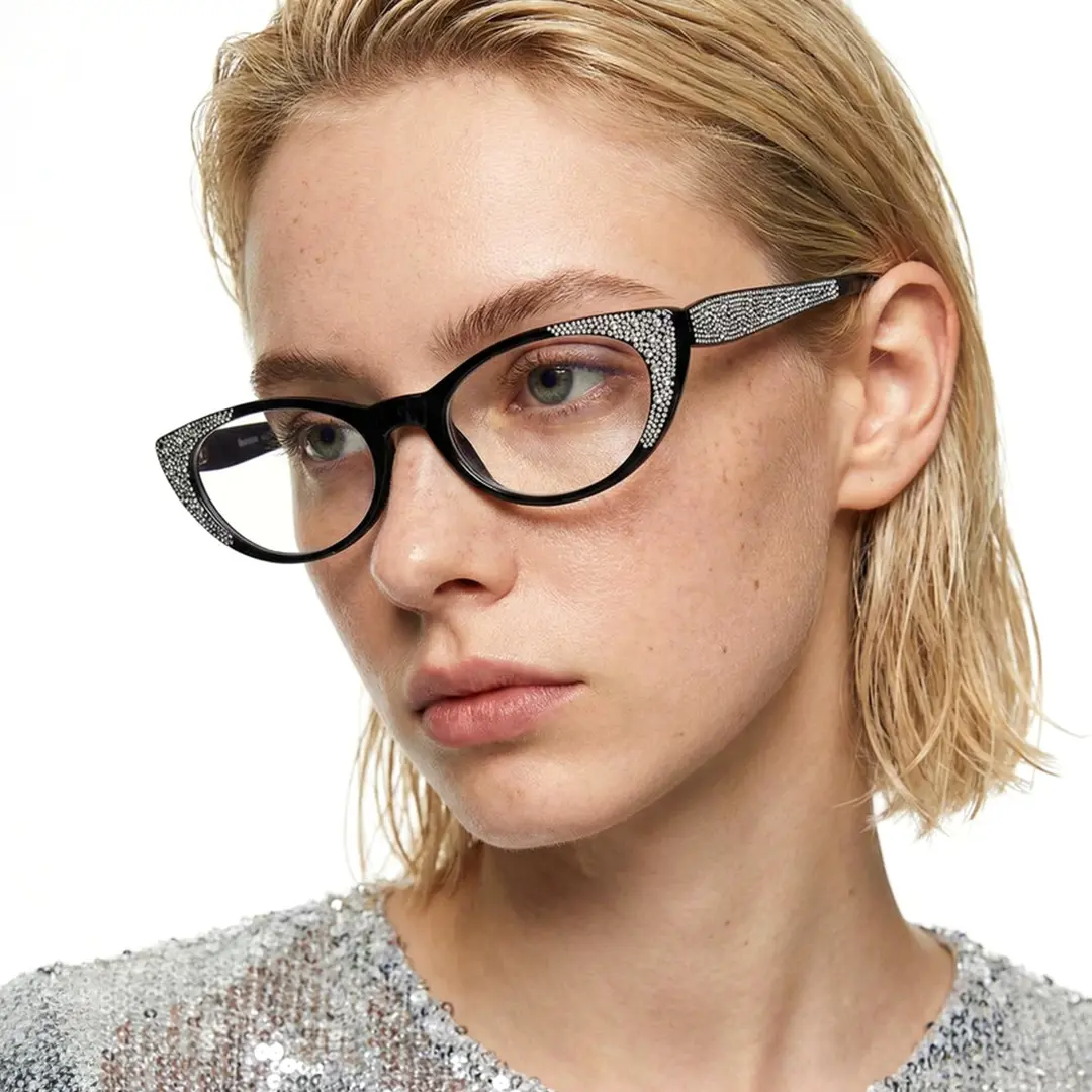 Profile view of female wearing black cat eye eyeglasses, neutral expression, CP0012308