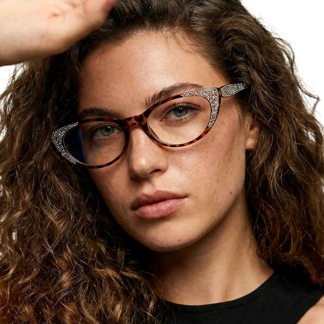 Three-quarter view of female wearing tortoise cat eye eyeglasses, neutral expression, CP0012308