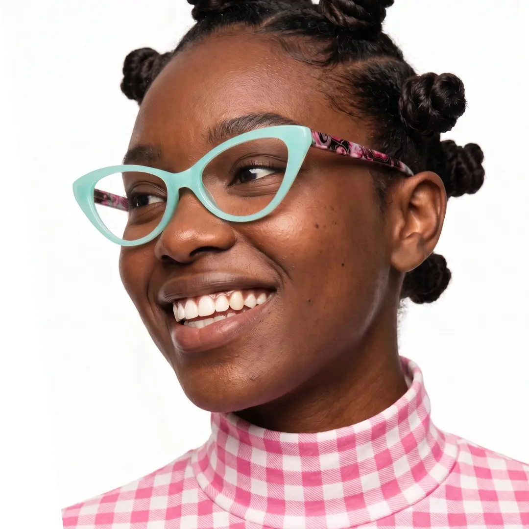 Three-quarter view of female wearing blue cat eye eyeglasses, smiling, CP0092404