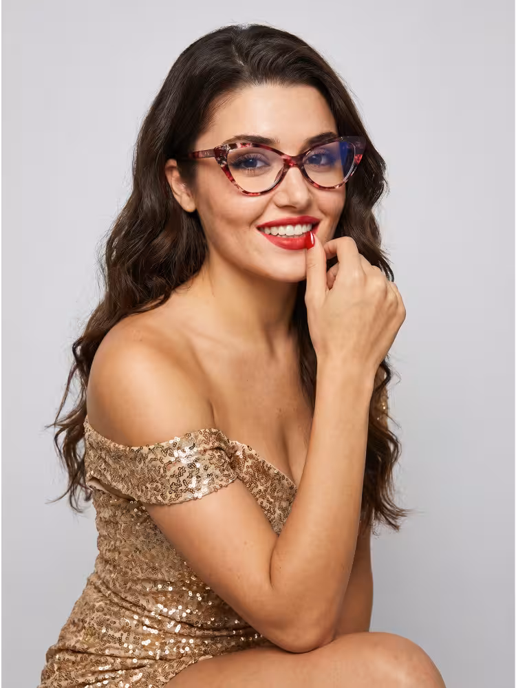 Female model wearing vintage red tortoise cat eye pc eyeglasses with gold sequin dress in grey studio portrait. SPU:CP0092404