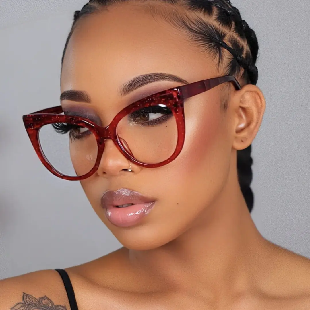 Three-quarter view of female wearing red cat eye eyeglasses, calm expression, CP0122306