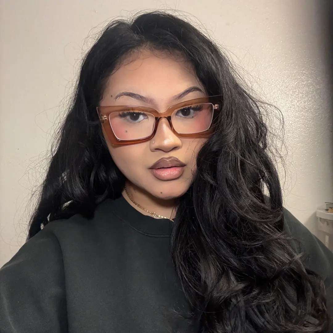 Front view of female wearing brown butterfly eyeglasses, neutral expression, CP0162310