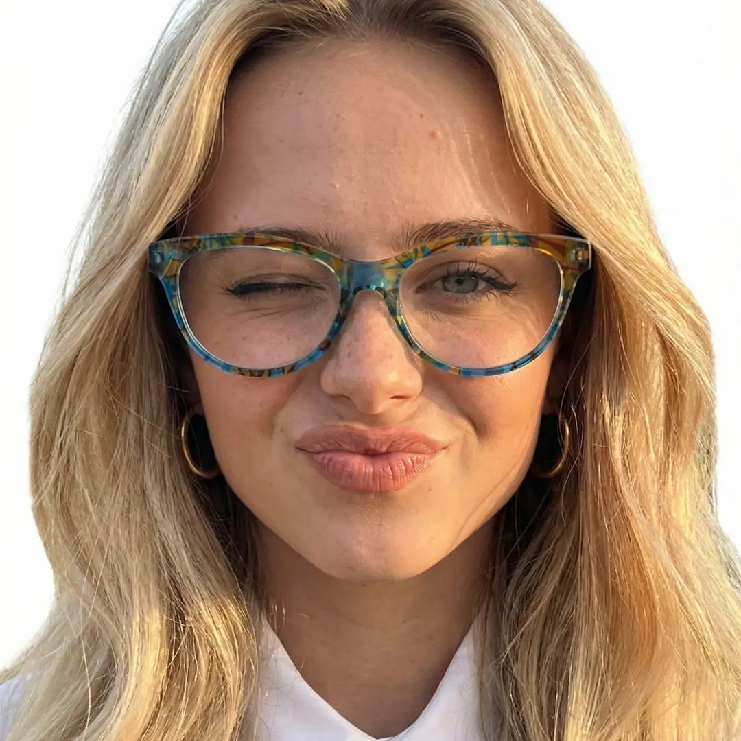 Front view of female wearing colorful blue cat eye eyeglasses, winking, pouting, CP0212303
