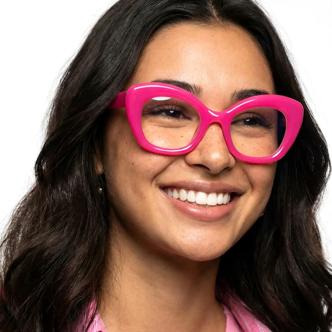 Front view of female wearing red cat eye eyeglasses, smiling, CP0302403