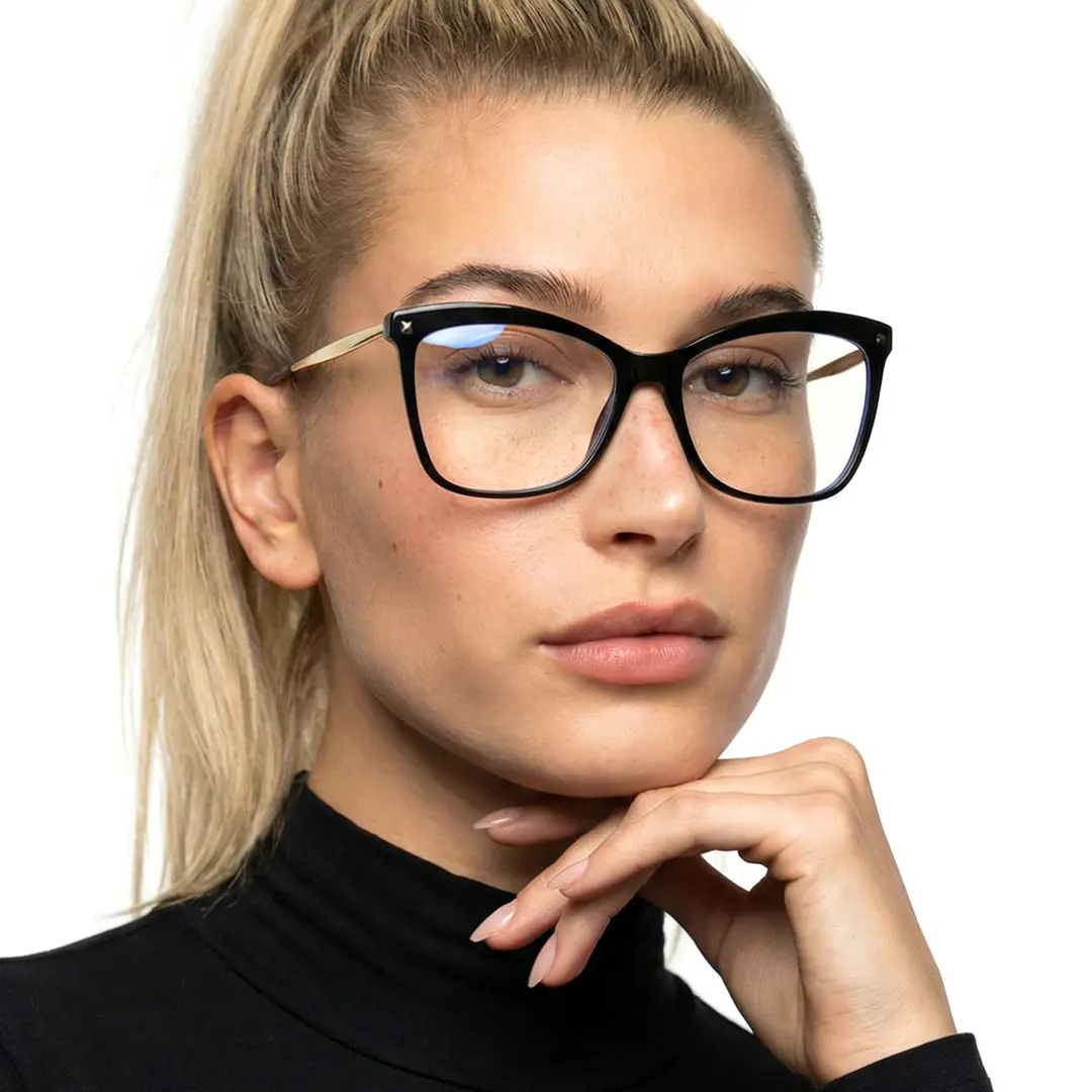 Portrait view of female wearing black cat eye eyeglasses, resting chin on hand, neutral expression, CP0422504