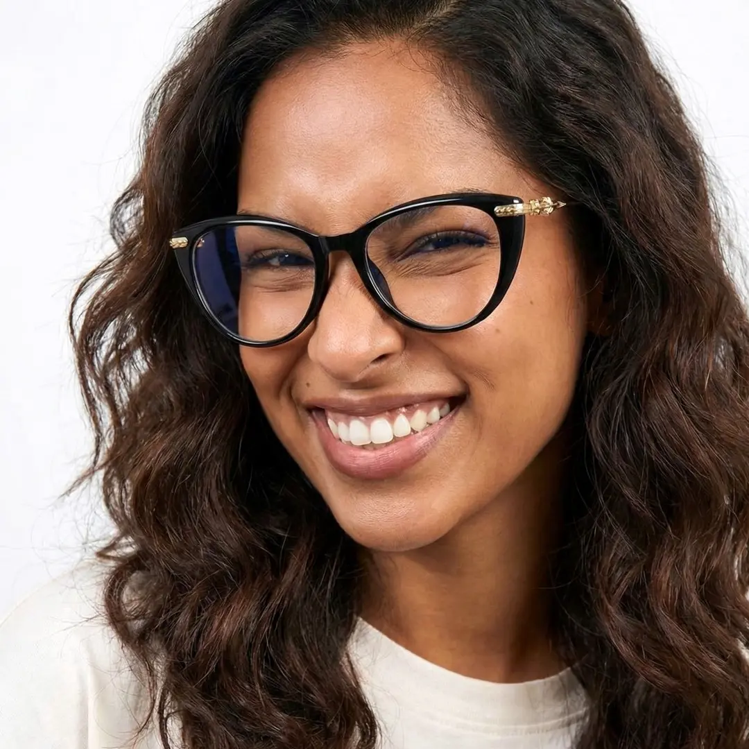 Slightly angled view of female wearing black cat eye eyeglasses, winking, smiling, CP0442505