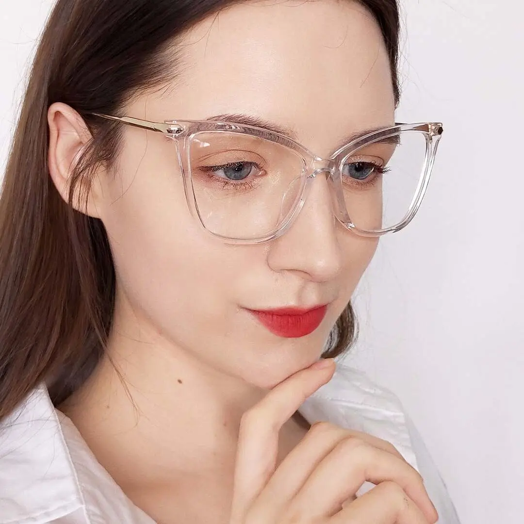 Three-quarter view of female wearing clear cat eye eyeglasses, relaxed expression, CR0032207