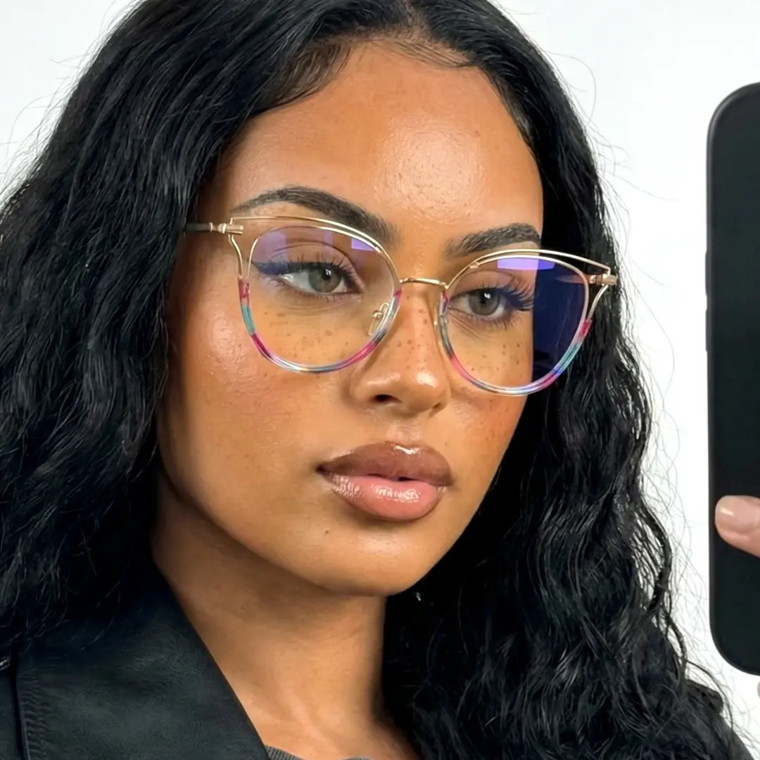 Front view of female wearing multicolor cat eye eyeglasses, relaxed expression, CR0032501