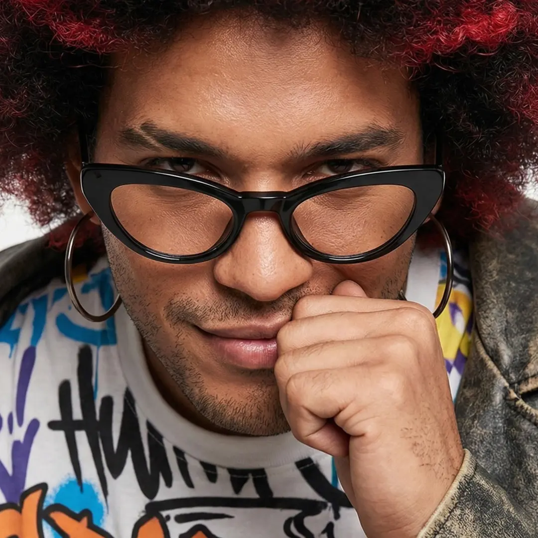 Close-up of male wearing black cat eye magnetic clip-on eyeglasses set with interchangeable clip-on lenses, resting chin on hand, confident expression, CR0032512