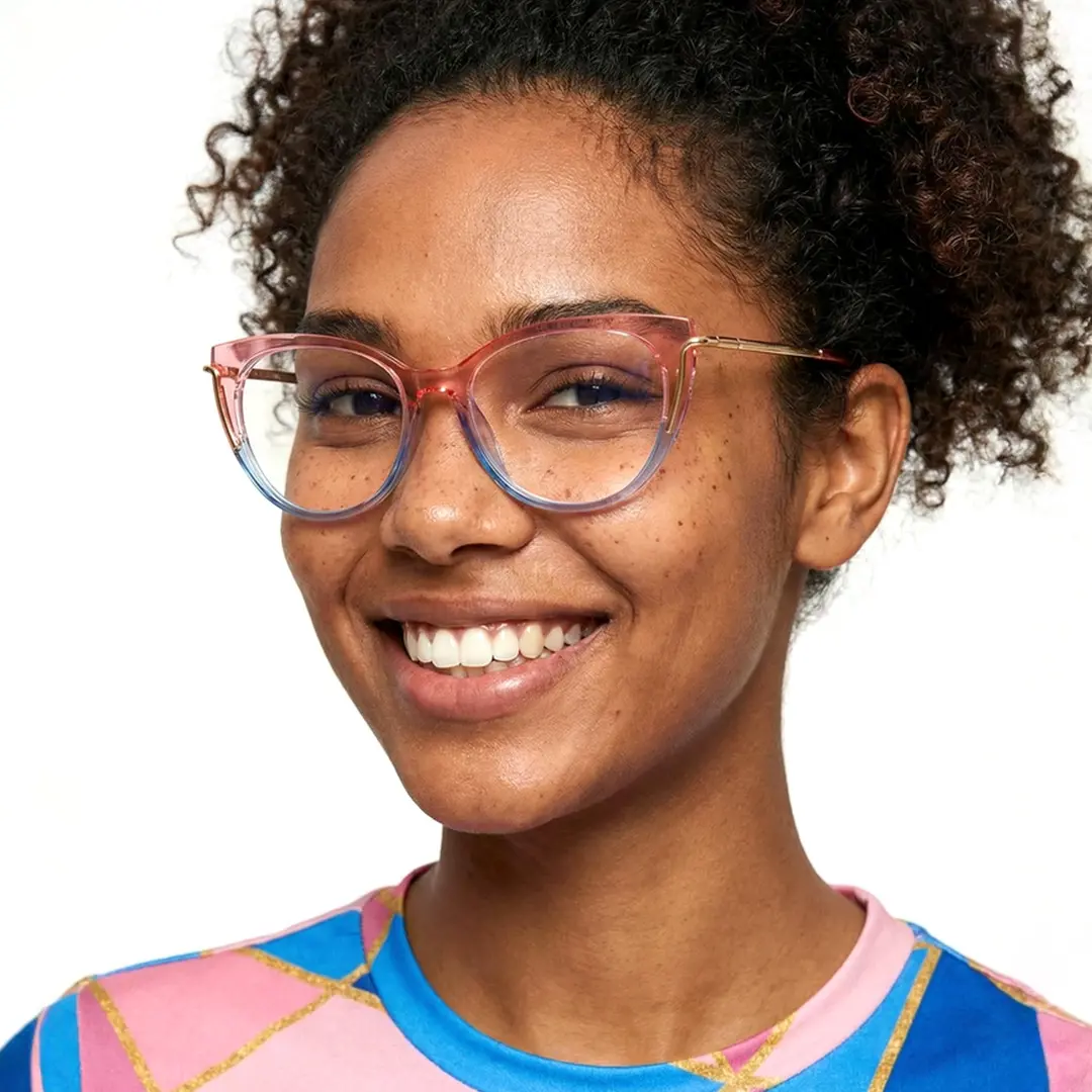 Front view of female wearing pink cat eye eyeglasses, smiling, CR0042402