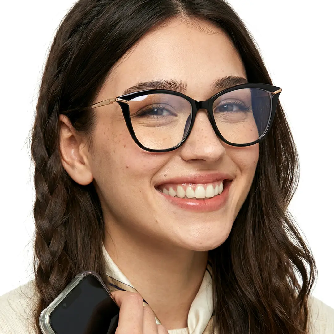 Front view of female wearing black cat eye eyeglasses, smiling, CR0042404