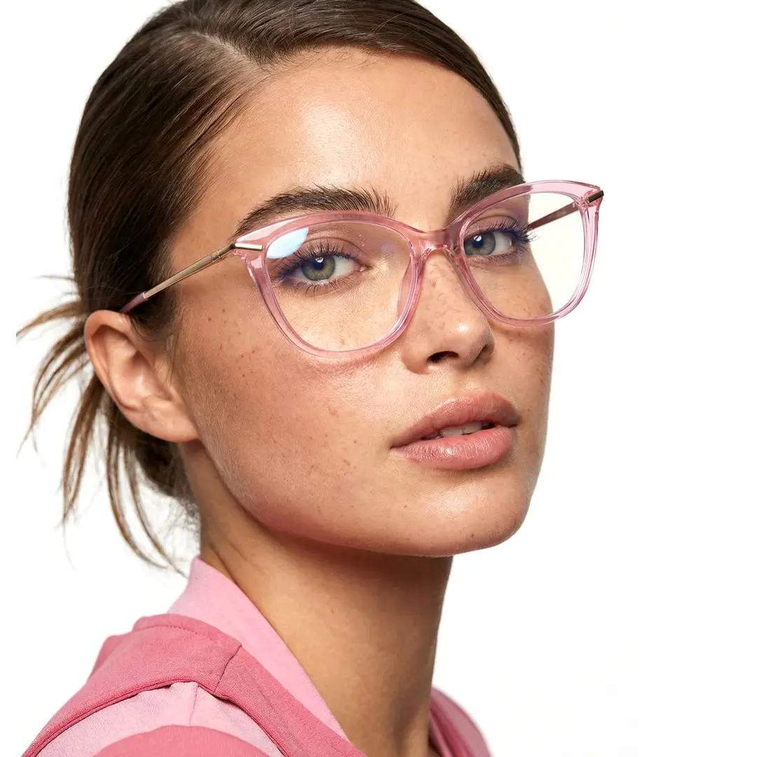 Three-quarter view of female wearing light pink cat eye eyeglasses, soft smile, CR0042404