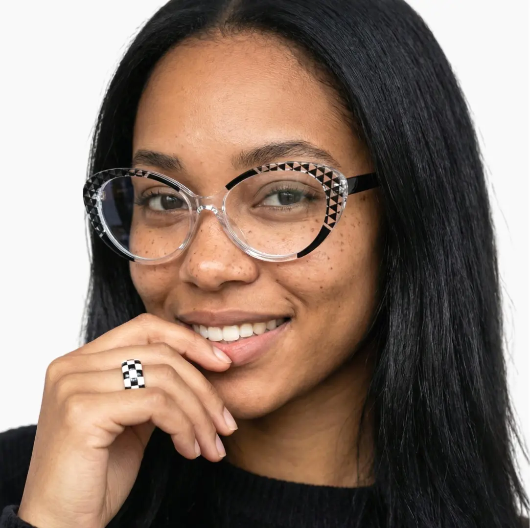 Front view of female wearing black cat eye eyeglasses, smiling, CR0042405