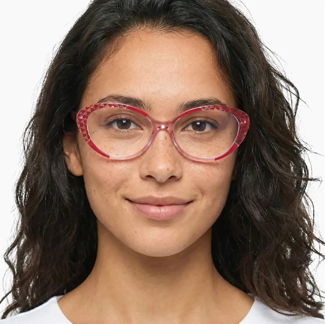 Front view of female wearing red tortoise cat eye eyeglasses, neutral expression, CR0042405