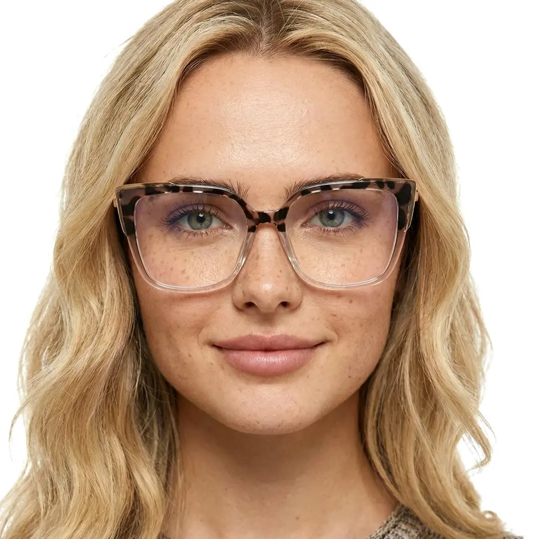 Front view of female wearing brown tortoise cat eye eyeglasses, neutral expression, CR0052409