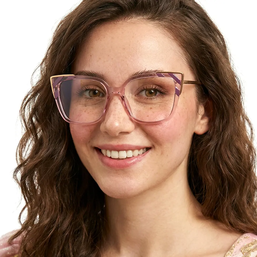 Three-quarter view of female wearing pink cat eye eyeglasses, smiling, CR0052409