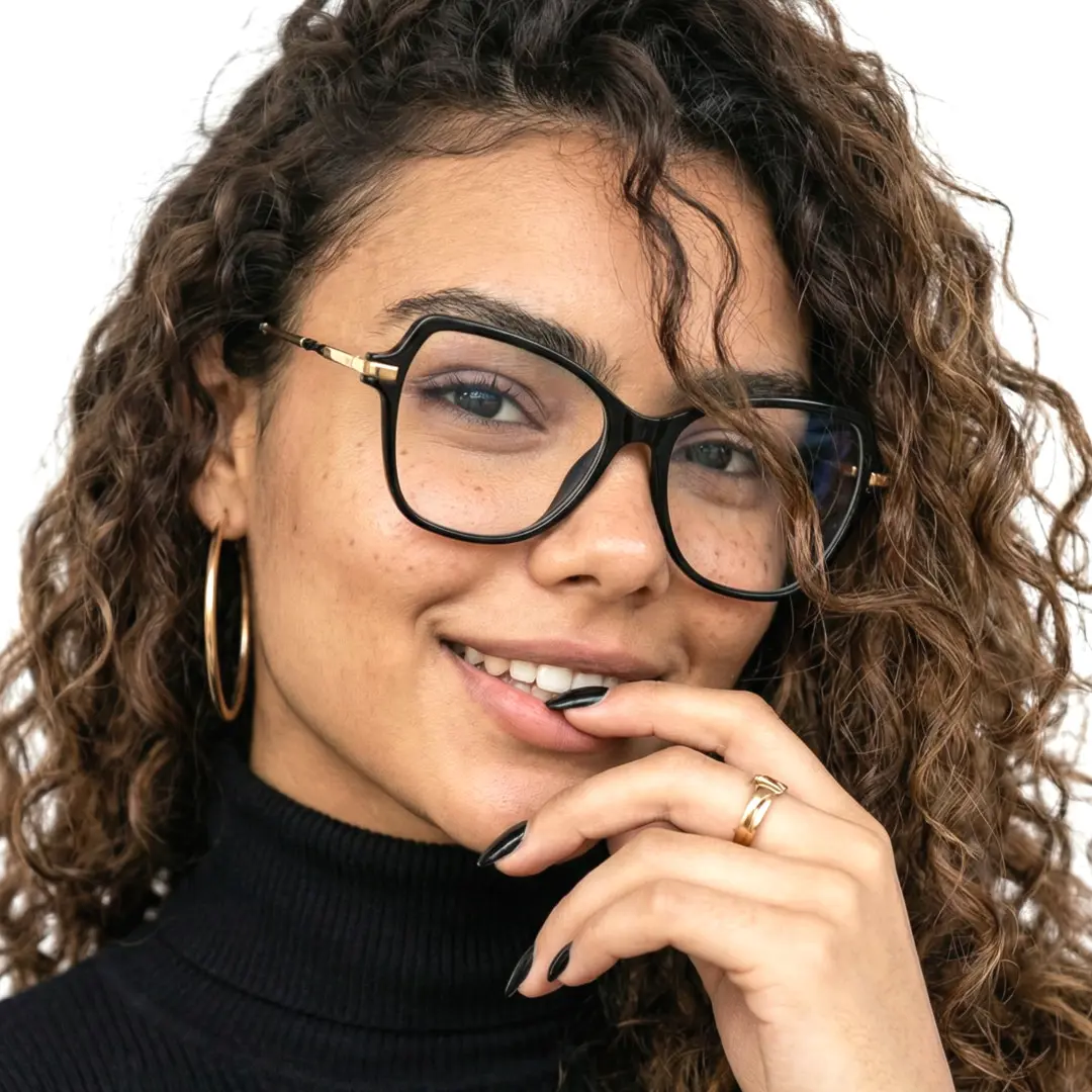 Three-quarter view of female wearing black cat eye eyeglasses, hand touching lips, natural smile, CR0052411