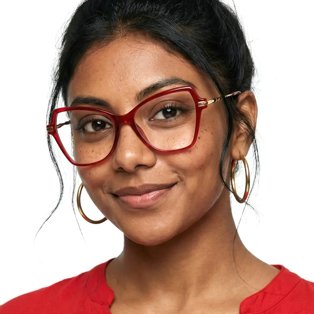 Slightly angled view of female wearing red cat eye eyeglasses, natural smile, CR0052411