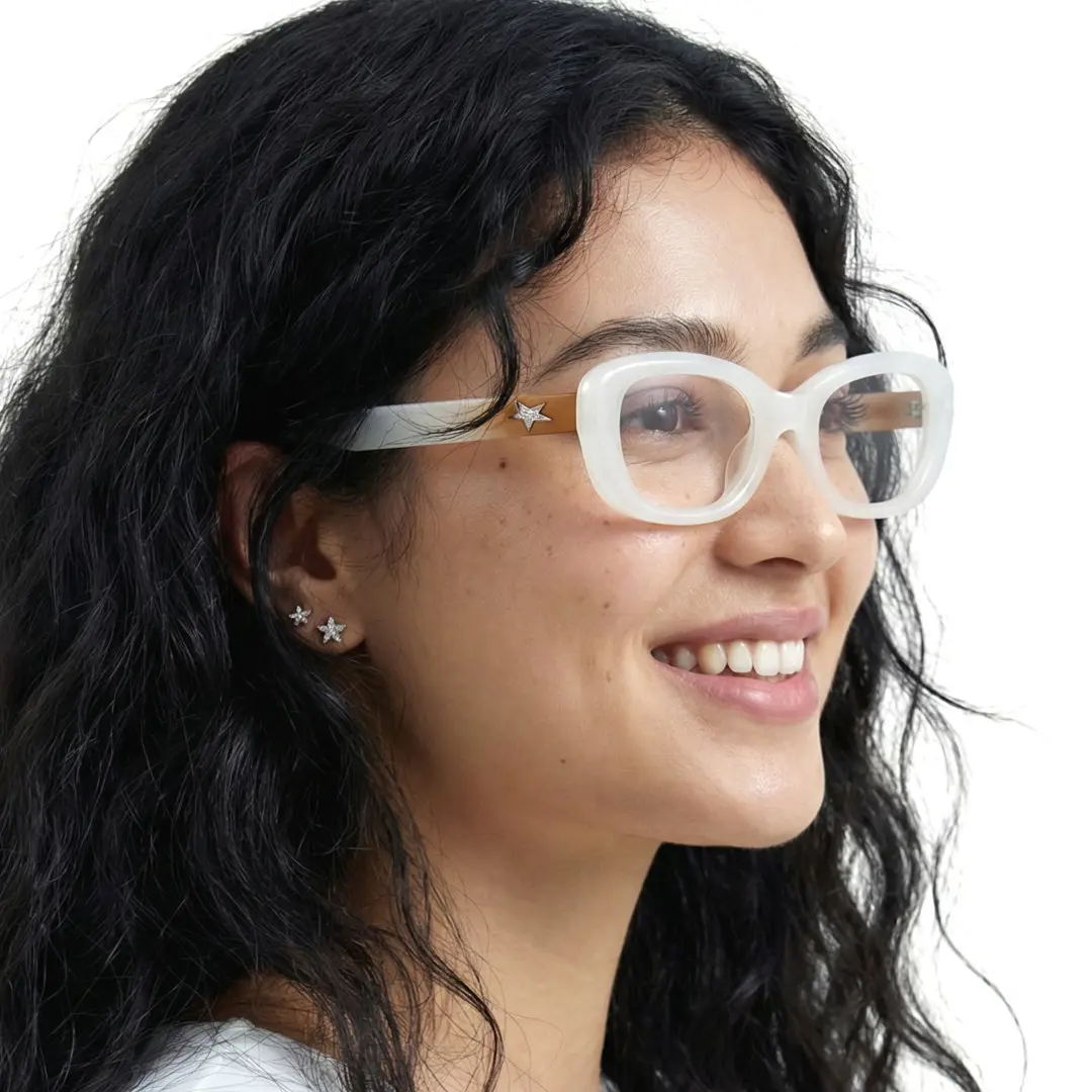 Looking away view of female wearing white cat eye eyeglasses, smiling, CR0062408