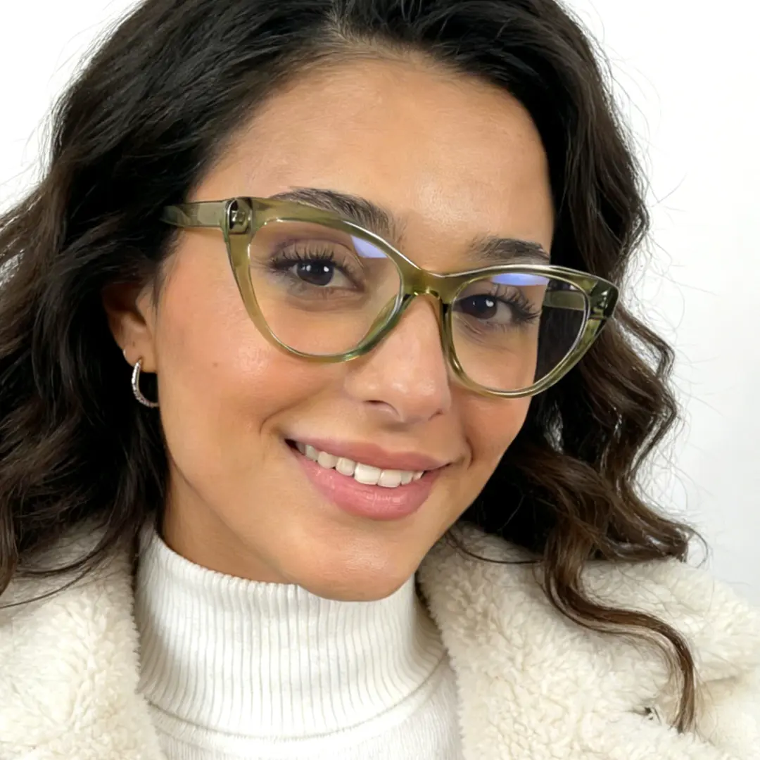 Three-quarter view of female wearing army green cat eye eyeglasses, friendly smile, CR0072404