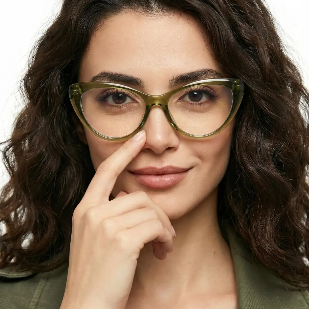 Front view of female wearing vintage army green cat eye eyeglasses, hand touching nose, natural smile, CR0072404