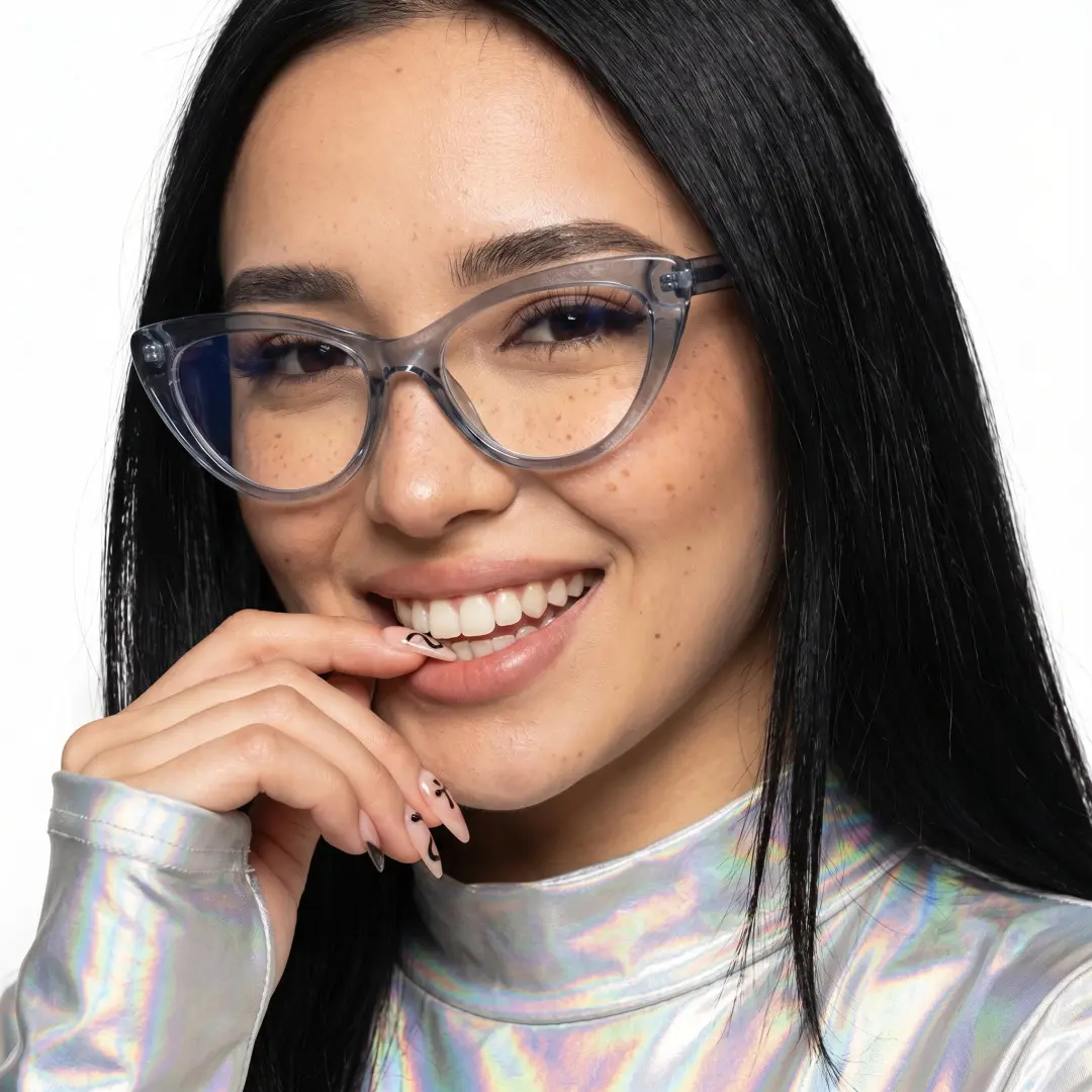 Three-quarter view of female wearing vintage blue cat eye eyeglasses, hand touching lips, smiling, CR0072404