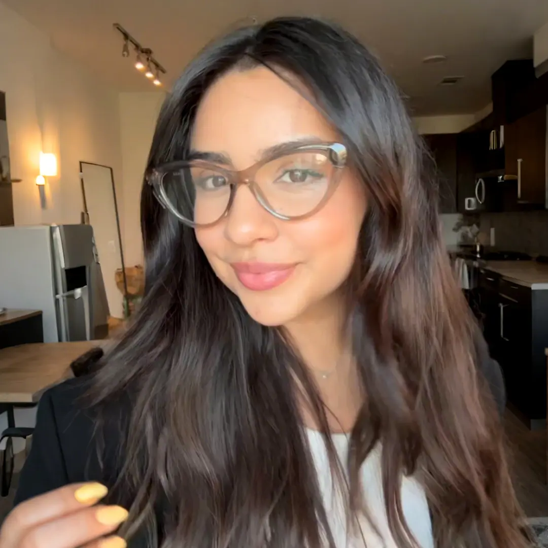 Profile view of female wearing maize yellow cat eye eyeglasses, Hand in hair, natural smile, CR0072404