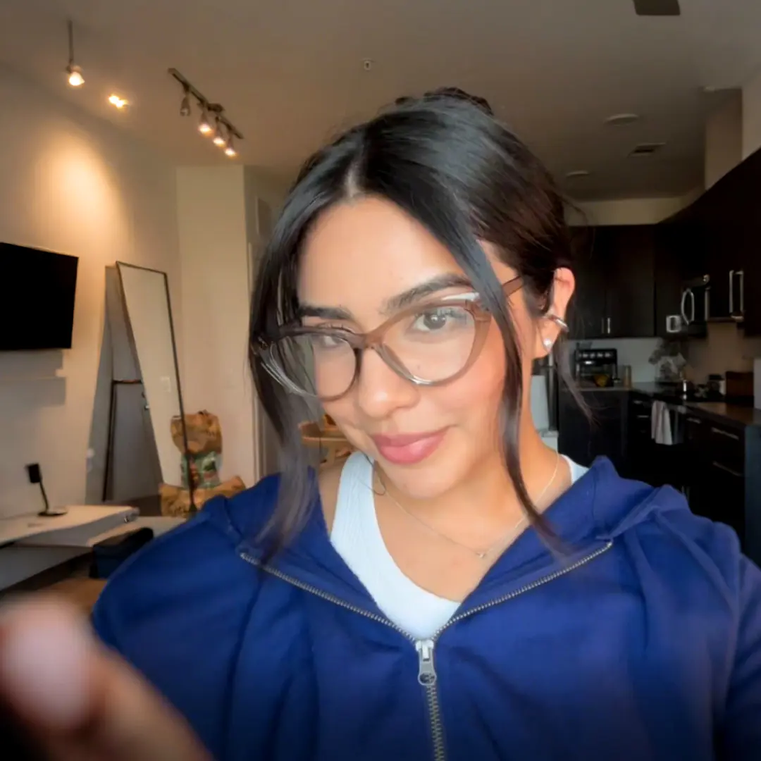 Three-quarter view of female wearing maize yellow cat eye eyeglasses, natural smile, CR0072404