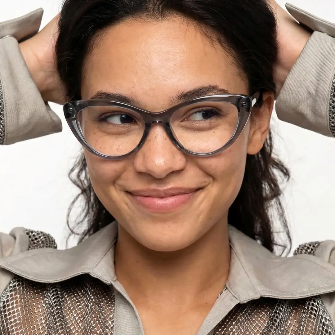 Close-up view of female wearing silver cat eye eyeglasses, natural smile, CR0072404