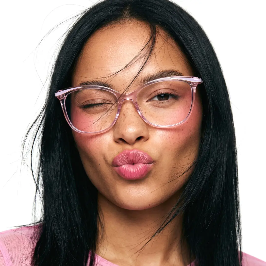 Front view of female wearing pink cat eye eyeglasses, pouting, natural expression, CR0072408