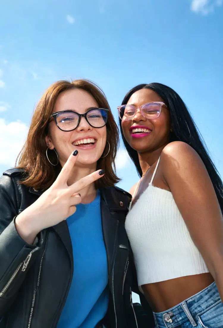 Two people model wearing everyday eyewear black cat eye tr90 eyeglasses under a bright blue sky. SPU: CR0072408
