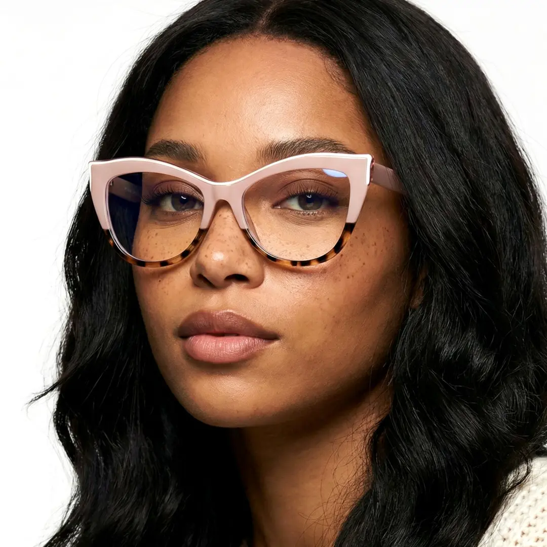Profile view of female wearing two-tone cat eye eyeglasses, neutral expression, CR0082403