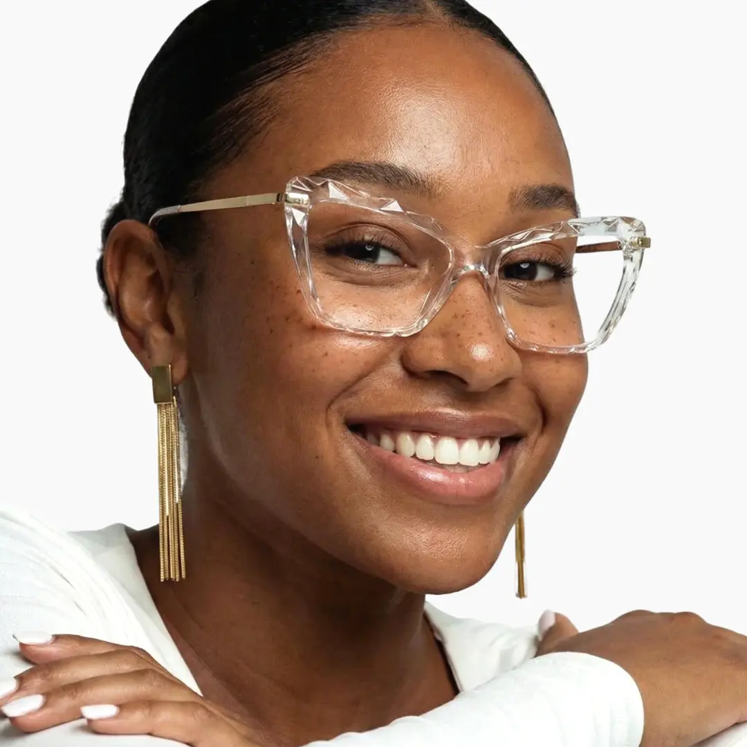 Three-quarter view of female wearing clear cat eye eyeglasses, natural smile, CR0082502
