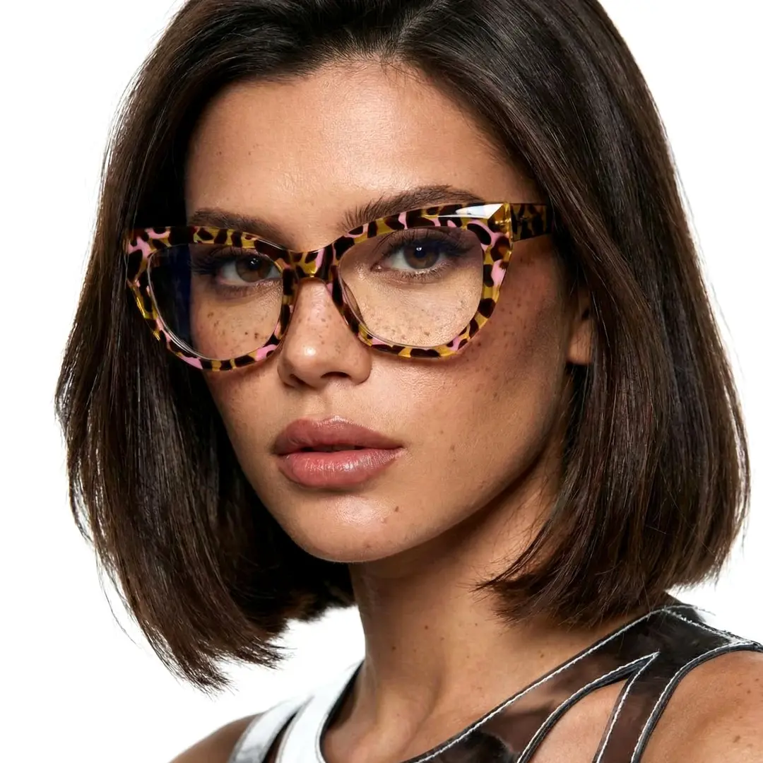 Three-quarter view of female wearing yellow tortoise cat eye eyeglasses, neutral expression, CR0092411