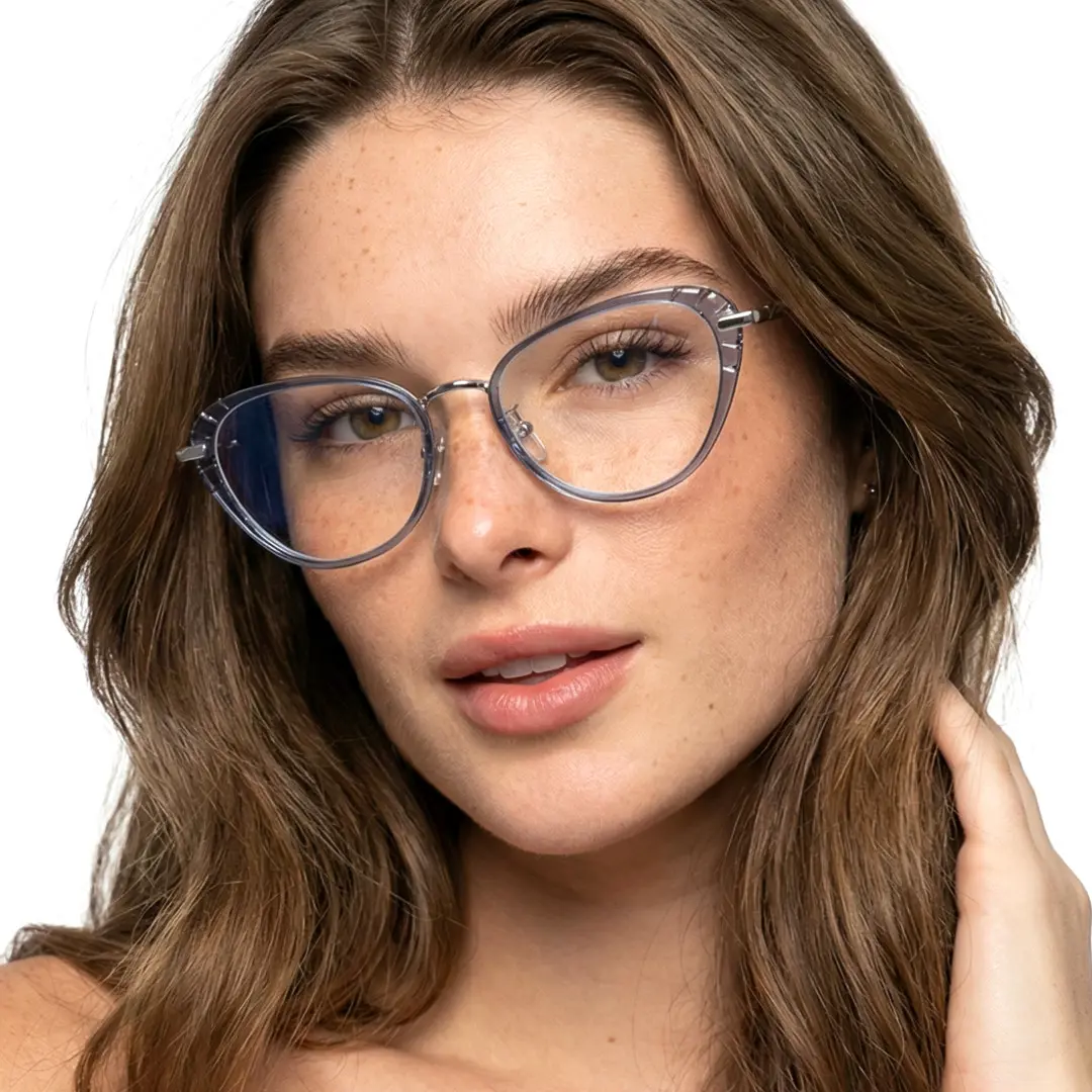 Front view of female wearing blue cat eye eyeglasses, hand in hair, natural smile, CR0102402