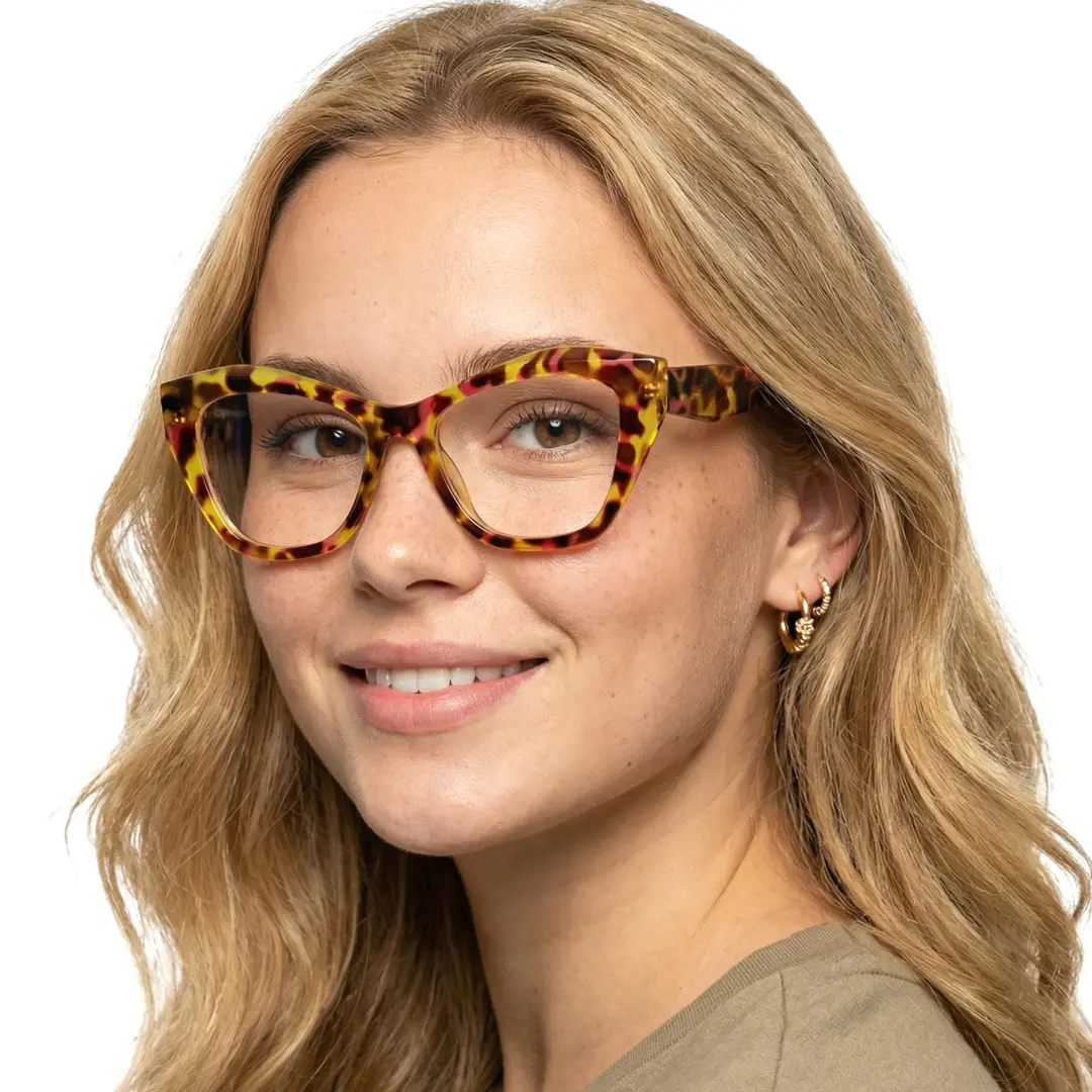 Close-up view of female wearing yellow tortoise cat eye eyeglasses, natural smile, CR0102411