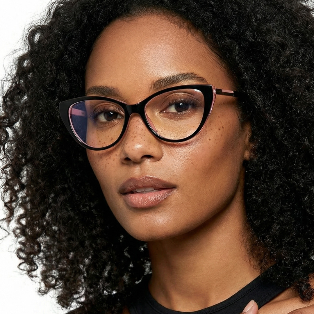 Front view of female wearing black cat eye eyeglasses, neutral expression, CR0112408