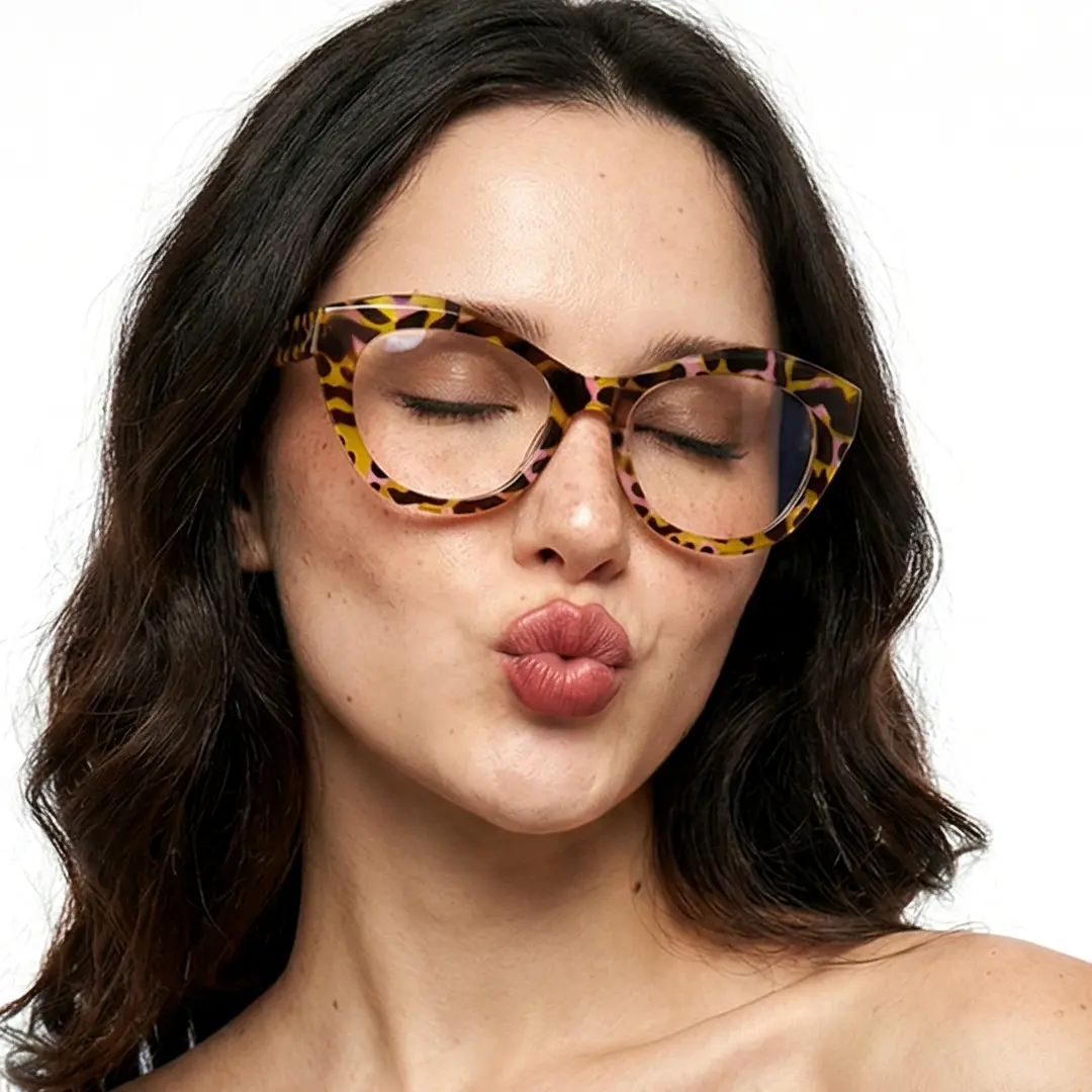 Front view of female wearing yellow tortoise cat eye eyeglasses, pouting, CR0112411