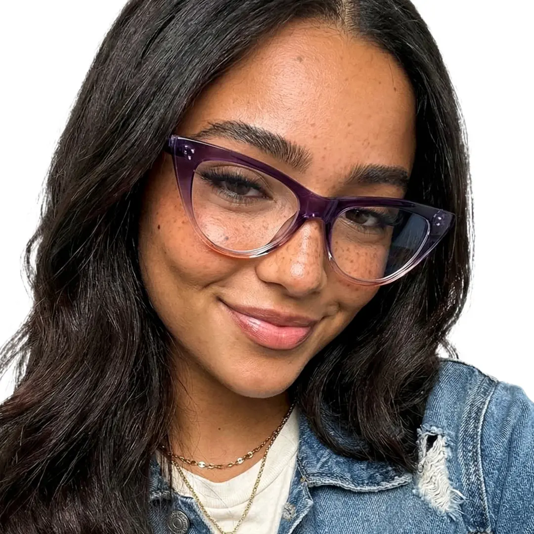 Tilted head view of female wearing light purple cat eye eyeglasses, natural expression, CR0132209