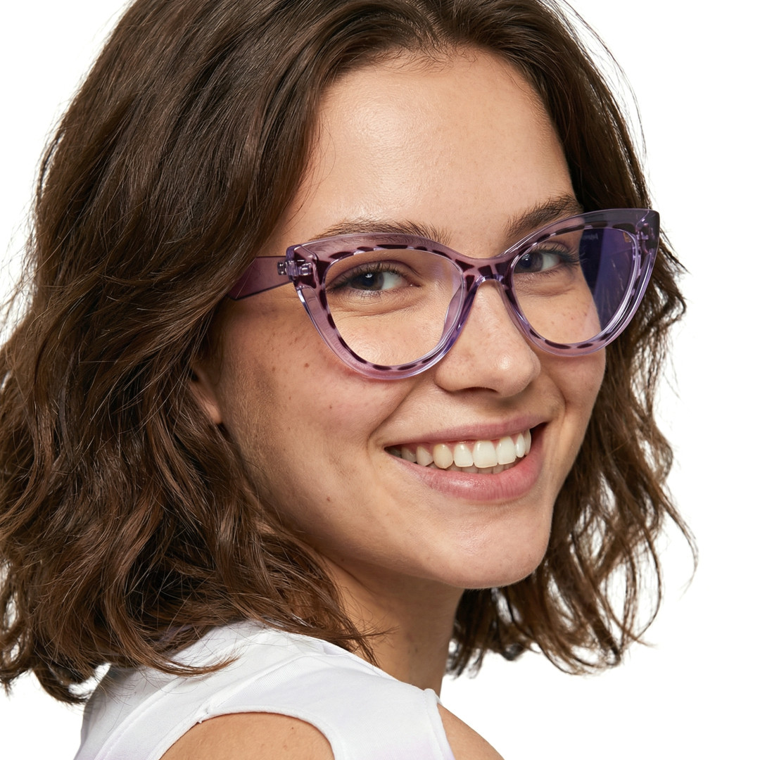 Over-the-shoulder view of female wearing vintage purple cat eye eyeglasses, smiling, CR0132408