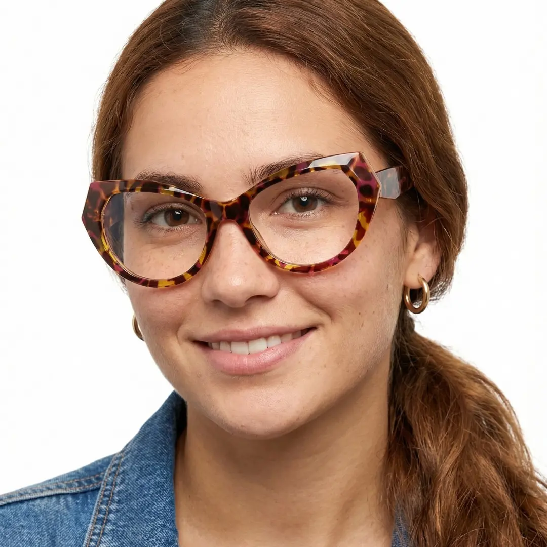 Front view of female wearing vintage tortoise cat eye eyeglasses, smiling, CR0132411